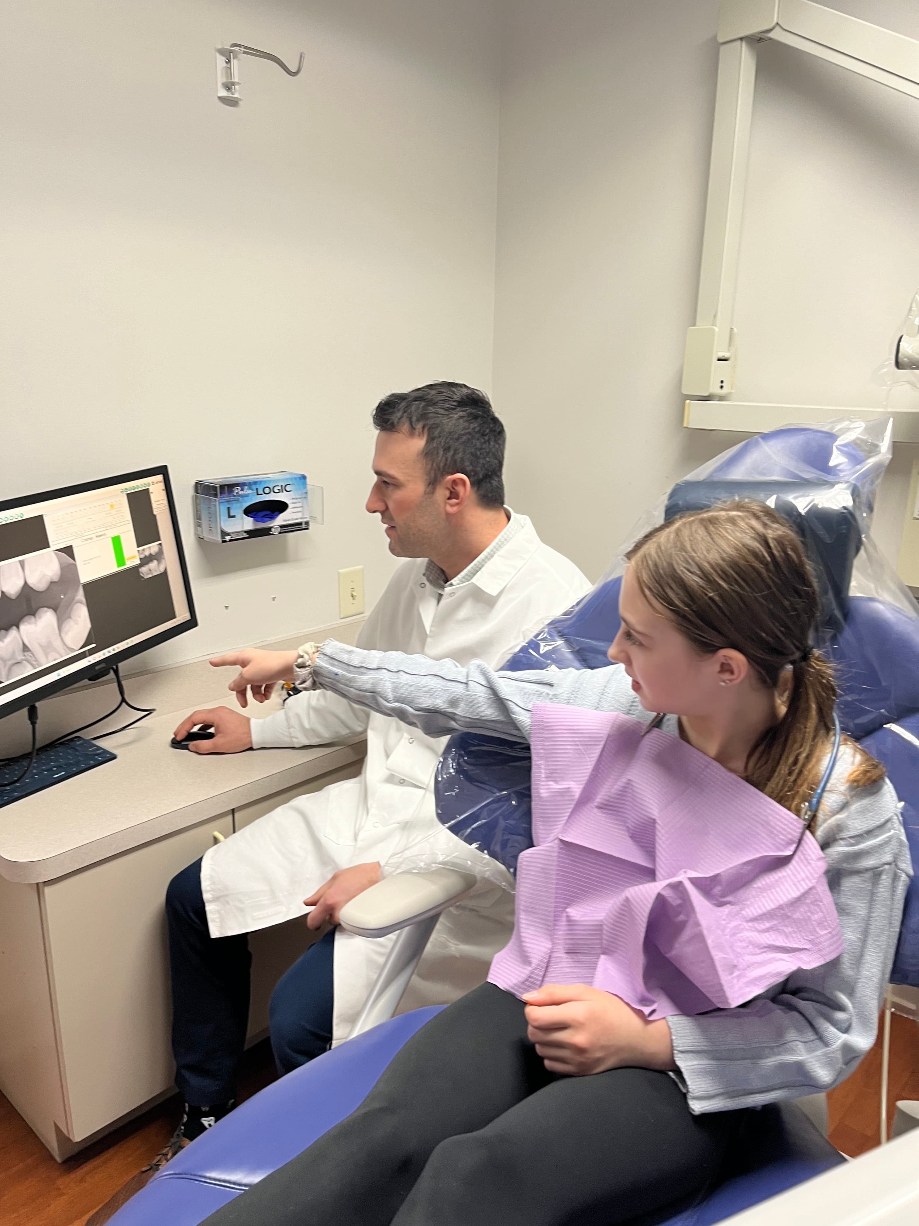 Dr. Ben treating a patient at Broadway Dental